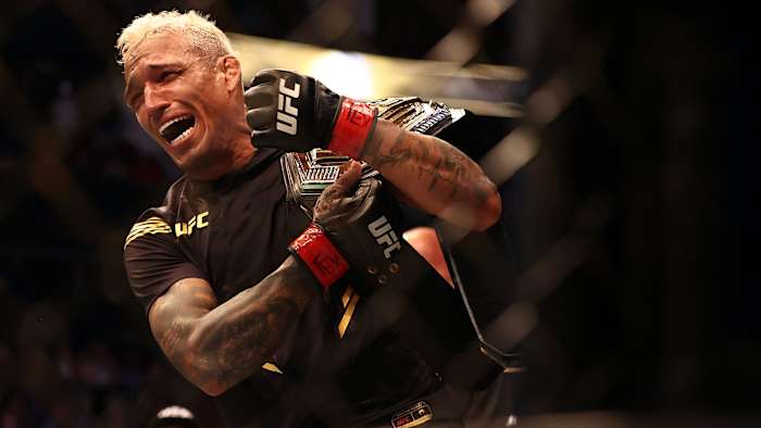 Charles Oliveira reacts following his championship victory against Michael Chandler during UFC 262 at Toyota Center.